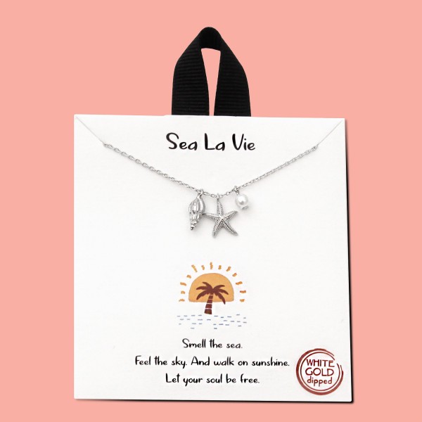 Dainty Chain Link Necklace Featuring Starfish, Conch Shell, and Pearl Pendants

- Approximately 16" L
- Extender 2" L
- Hypoallergenic Brass Base
- 18K Gold or White Gold Dipped
- Made in Korea 
- Card: " Smell the sea, feel the sky, And walk on sunshine. Let you soul be free" 