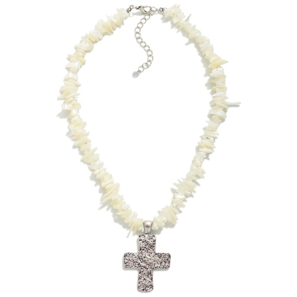 Puka Stone Beaded Necklace With Silver Cross Pendant

- Approximately 18" L
- Extender 3" L