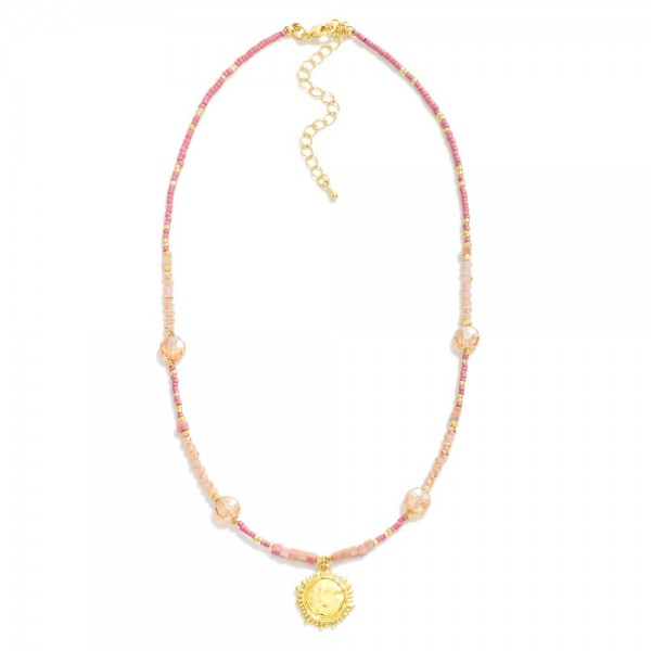 Beaded Necklace Featuring Glass Crystal Bead Stations & Metal Tone Sun Pendant 

- Approximately 16" L
- Extender 3" L