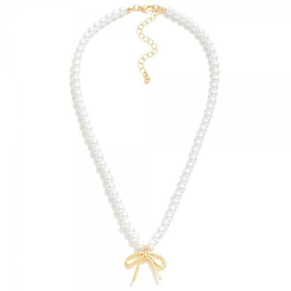 Pearl Bead Necklace Featuring Bow Pendant 

- Approximately 16" L
- Extender 2" L