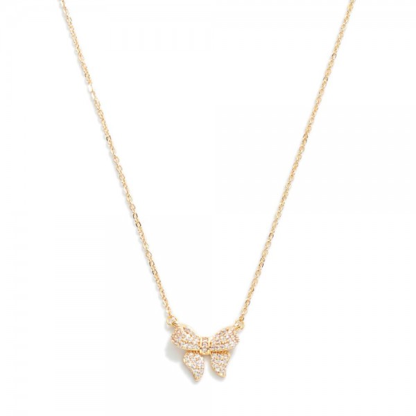 Metal Tone Dainty Chain Link Necklace Featuring Cubic Zirconia Studded Bow Station 

- Approximately 16" L
- Extender 2.5" L