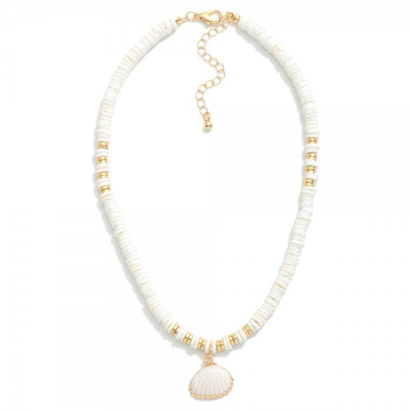 Beaded Puka Shell Necklace Featuring Gold Tones & Clam Shell Pendant 

- Approximately 16" L