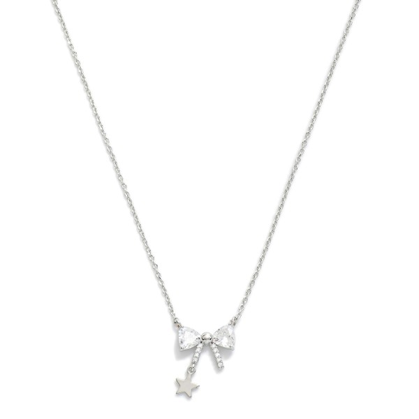 Gold Dipped Dainty Chain Link Necklace Featuring Rhinestone Bow & Star Pendant 

- Approximately 16" L
- Extender 2" L