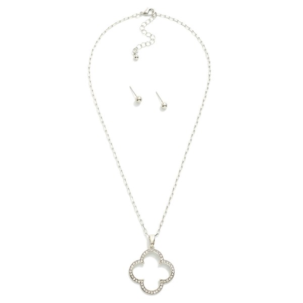 Metal Tone Paperclip Chain Necklace Featuring Hollow Rhinestone Studded Clover Pendant 

- Metal Tone Ball Stud Earrings Included
- Approximately 14" L
- Extender 3" L