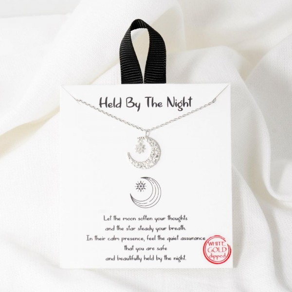 Dainty Chain Link Necklace Featuring Cubic Zirconia Moon & Stars Pendant  				
					
- Approximately 16" L					
- Extender 2" L					
- Hypoallergenic Brass Base					
- 18K Gold Dipped					
- Card: "Let the moon soften your thoughts and the star steady your breath. In their calm presence, feel the quiet assurance that you are safe and beautifully held by the night."