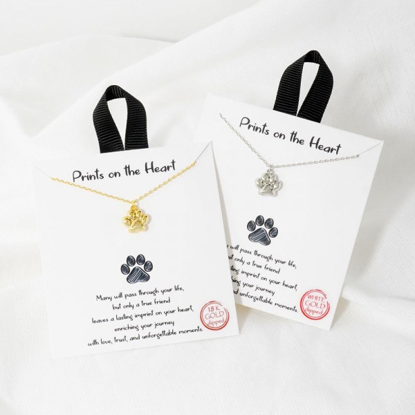 Dainty Chain Link Necklace Featuring Metal Tone Paw Print Pendant 				
					
- Approximately 16" L					
- Extender 2" L									
- Hypoallergenic Brass Base					
- 18K Gold Dipped					
- Card: "Many will pass through your life, but only a true friend leaves a lasting imprint on your heart, enriching your journey with love, trust, and unforgettable moments."					