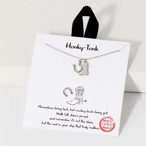Dainty Chain Link Necklace Featuring Metal Tone Cowboy Boot & Horseshoe Pendants 				
					
- Approximately 16" L					
- Extender 2" L					
- Hypoallergenic Brass Base					
- 18K Gold Dipped					
- Card: "Horseshoes bring luck, but cowboy boots bring grit. Walk tall, dance proud, and remember it's not the shine, but the soul in your step that truly matters."					