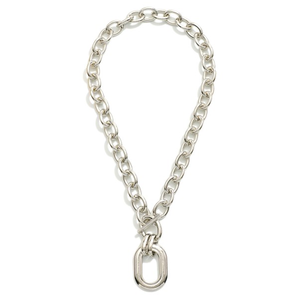 Chunky Metal Tone Chain Link Necklace Featuring Toggle Clasp & Oval Pendant 

- Approximately 16" L