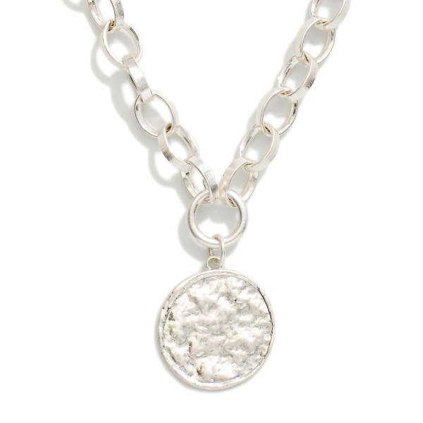 Chain Link Necklace Featuring Metal Tone Coin Pendant 

- Approximately 18" L 