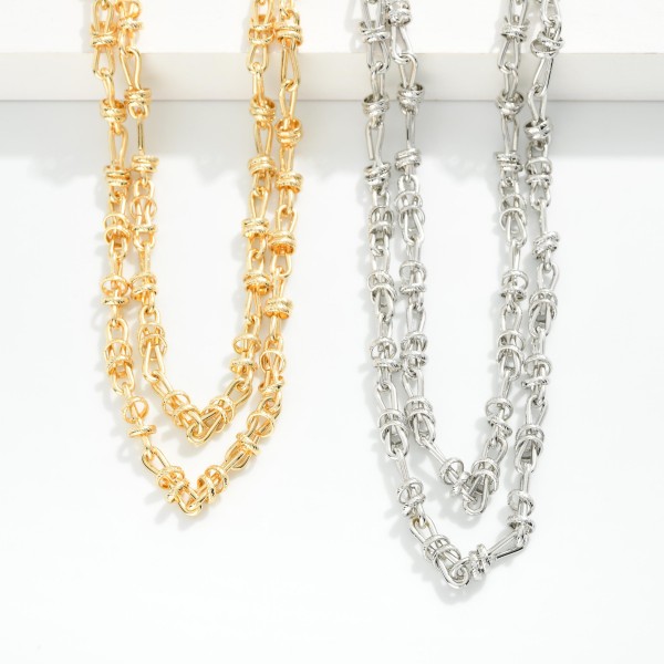 Gold Tone Rope Knot Chain Link Necklace Featuring Metal Rings 

- Approximately 16" L