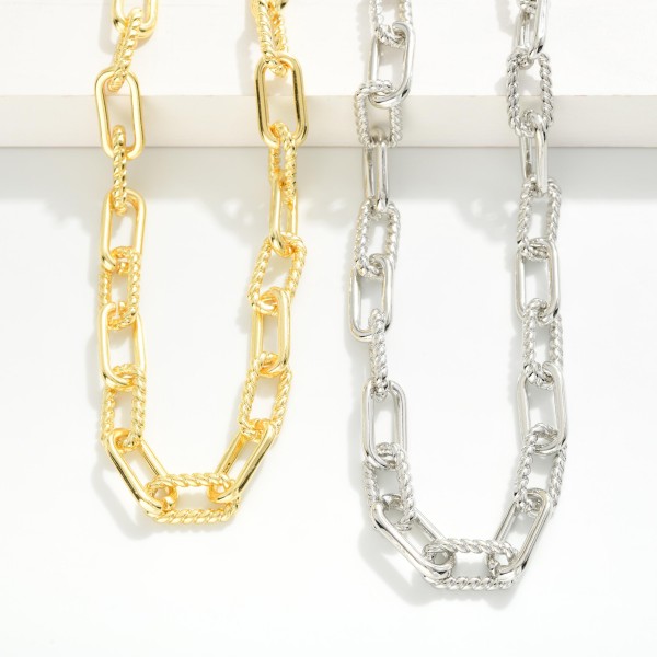 Chain Link Necklace Featuring Twisted Metal Links 

- Approximately 18" L
- Extender 1" L