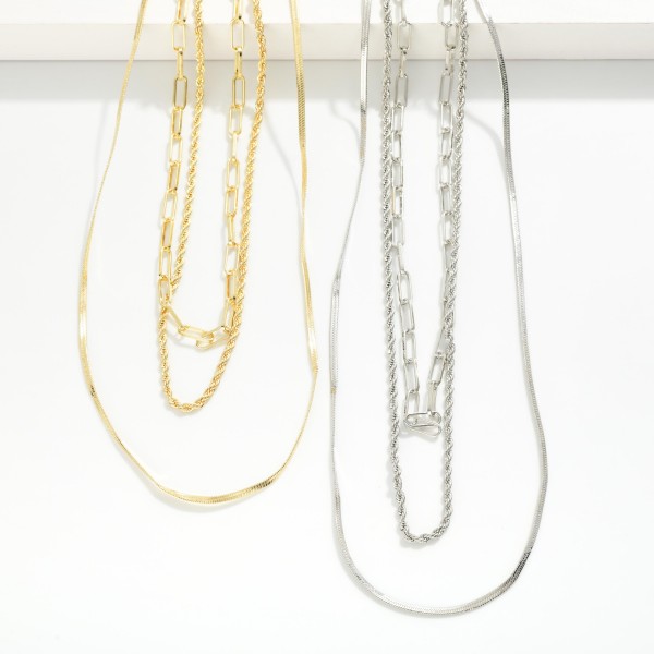 Layered Chain Link Necklace Featuring Herringbone, Twisted, & Paperclip Chains 

- Gold Dipped 
- Approximately 16" L
- Extender 1.5" L