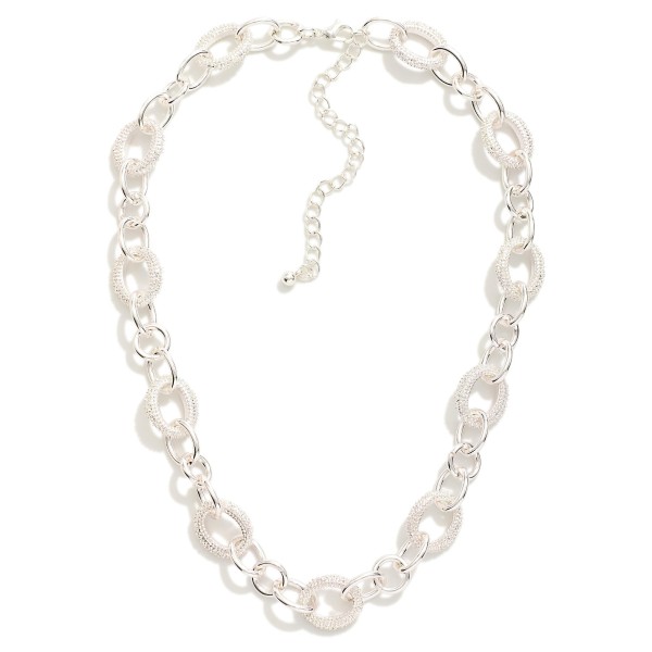 Chain Link Necklace Featuring Linked Textured Metal Oval 

- Approximately 16" L 
- Extender 3" L 