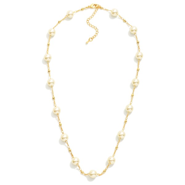 Chain Link Necklace Featuring Gold Tone Ball & Pearl Ball Stations

- Approximately 18" L
- Extender 2" L
- 18k Gold Filled
- Hypoallergenic
- Made In Brazil

