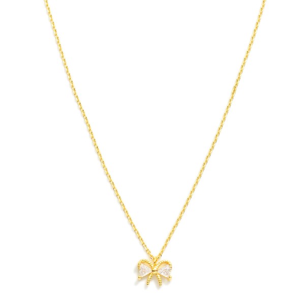 Chain Link Necklace Featuring Metal Tone Bow Pendant With Rhinestones 

- Approximately 16" L
- Extender 2" L
- 18k Gold Filled
- Hypoallergenic
- Made In Brazil
