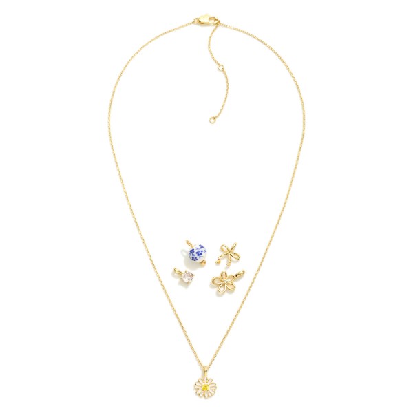 Chain Link Necklace Featuring Interchangeable Pendant 

- Includes: Flower, Bow, Chinoiserie Ball, & Cubic Zirconia 
- Approximately 16" L
- Extender 2" L 