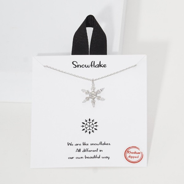 Dainty Chain Link Necklace Featuring Cubic Zirconia Snowflake Pendant 						
						
- Approximately 16" L						
- Extender 2" L						
- Hypoallergenic Brass Base						
- 18K Gold Dipped						
- Card: "We are like snowflakes. All different in our own beautiful way."	