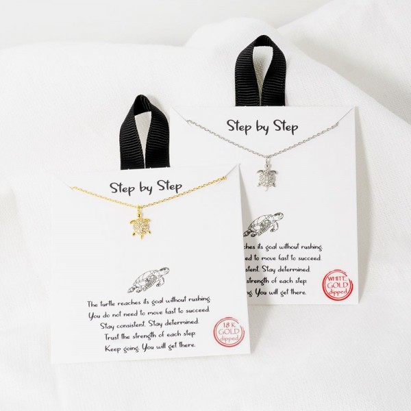 Dainty Chain Link Necklace Featuring Cubic Zirconia Sea Turtle Pendant 				
					
- Approximately 16" L					
- Extender 2" L					
- Hypoallergenic Brass Base					
- 18K Gold Dipped					
- Card: "The turtle reaches its goal without rushing. You do not need to move fast to succeed. Stay consistent. Stay determined. Trust the strength of each step. Keep going. You will get there."