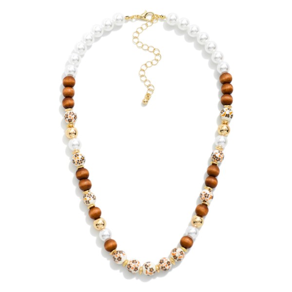 Beaded Necklace Featuring Wood, Pearl, & Floral Porcelain Beads 

- Approximately 14" L
- Extender 3" L