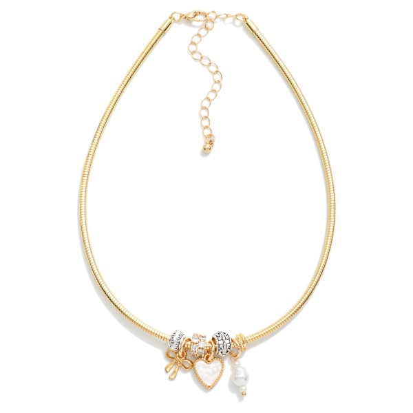 Metal Tone Snake Chain Featuring Metal Tone Charms With Rhinestones & Pearl

- Approximately 10" L 
- Extender 3" L 