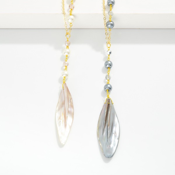 Long Chain Link Necklace Featuring Pearl Stations & Shell Pendant 

- Approximately 20" L
- Extender 3" L