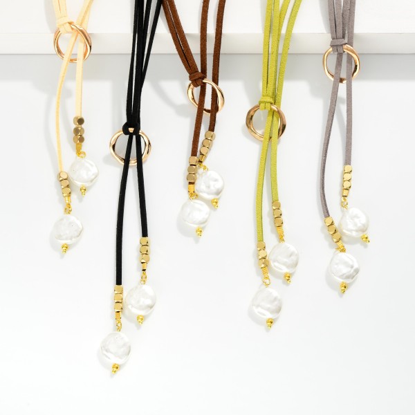 Leather Y Necklace Featuring Flat Pearl Pendants 

- Approximately 14" L
- Extender 2" L