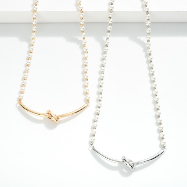 Pearl & Metal Tone Beaded Necklace Featuring Metal Tone Knotted Bar 

- Approximately 16" L
- Extender 3" L