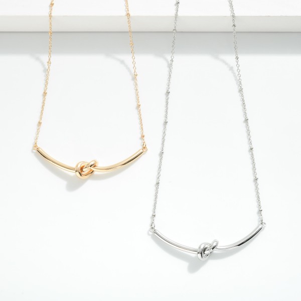 Chain Link Necklace Featuring Metal Tone Knotted Bar Detail

- Approximately 18" L
- Extender 3" L