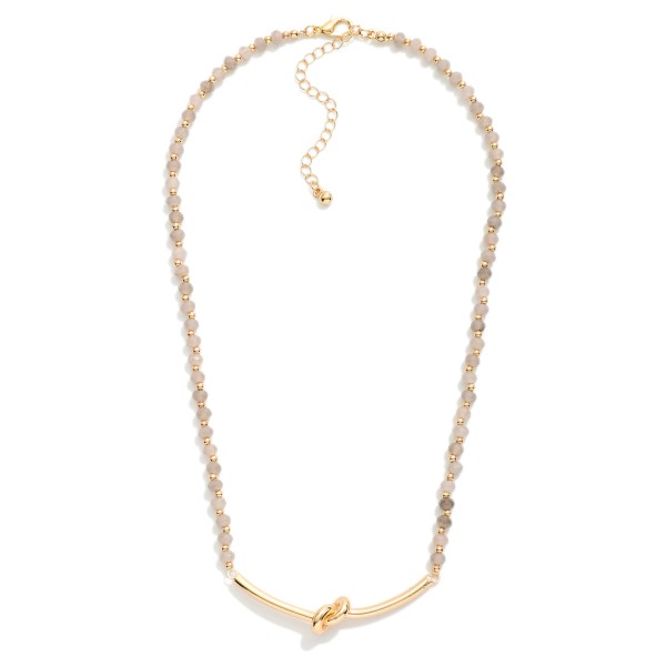 Faceted Bead Necklace Featuring Metal Tone Knotted Pendant 

- Approximately 16" L
- Extender 3" L