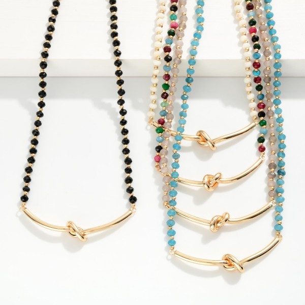 Faceted Bead Necklace Featuring Metal Tone Knotted Pendant 

- Approximately 16" L
- Extender 3" L