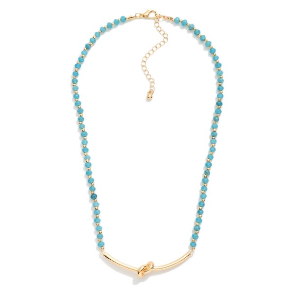 Faceted Bead Necklace Featuring Metal Tone Knotted Pendant 

- Approximately 16" L
- Extender 3" L