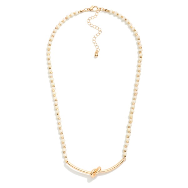 Faceted Bead Necklace Featuring Metal Tone Knotted Pendant 

- Approximately 16" L
- Extender 3" L