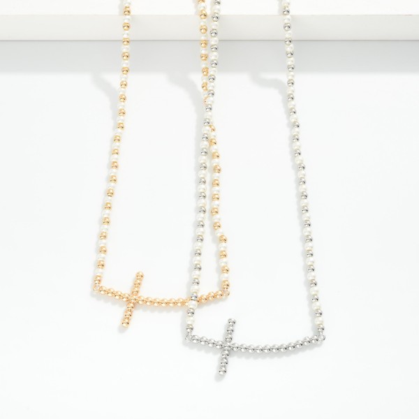 Pearl & Metal Tone Beaded Necklace Featuring Metal Tone Beaded Cross

- Approximately 16" L
- Extender 3" L

