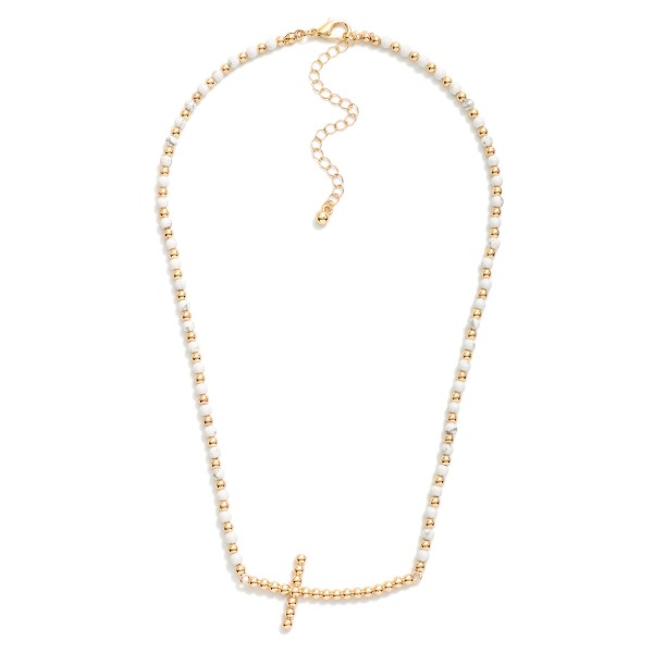 Stone Beaded Necklace Featuring Metal Tone Bubble East West Cross Pendant 

- Approximately 16" L
- Extender 3" L