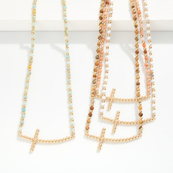 Stone Beaded Necklace Featuring Metal Tone Bubble East West Cross Pendant 

- Approximately 16" L
- Extender 3" L