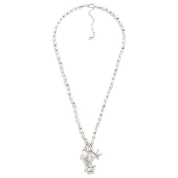 Pearl & Metal Tone Beaded Necklace Featuring Metal Tone Toggle Clasp With Fish Pendent 

- Approximately 20" L
- Extender 3" L

