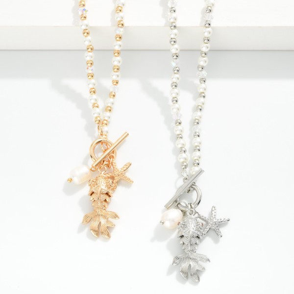 Pearl & Metal Tone Beaded Necklace Featuring Metal Tone Toggle Clasp With Fish Pendent 

- Approximately 20" L
- Extender 3" L

