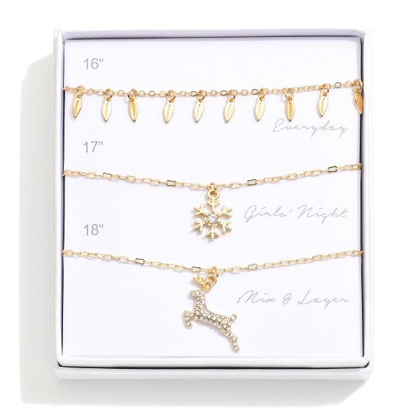 Set Of Three Chain Link Pendant Necklaces Featuring Snowflake & Rhinestone Reindeer 

- Giftbox Included
- Approximately 16" L - 18" L