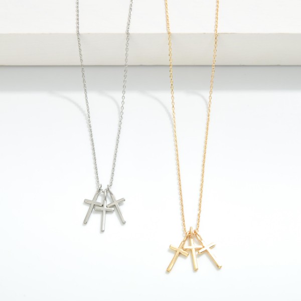 Metal Tone Necklace Featuring Cross Pendants
- Approximately 14" L
- Extender 3" L