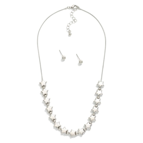 Snake Chain Necklace Featuring Metal Tone Stars 
- Metal Tone Stud Earrings Included 
- Approximately 16" L
- Extender 3" L