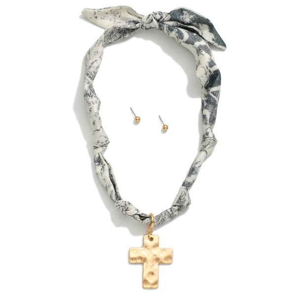 Bandana Necklace Featuring Gold Tone Hammered Cross Pendent 

- Approximately 20" L
- Metal Tone Stud Earrings Included
