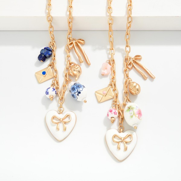Chain Link Necklace Featuring Metal Tones & Porcelain Charms  
- Approximately 16" L
- Extender 3" L