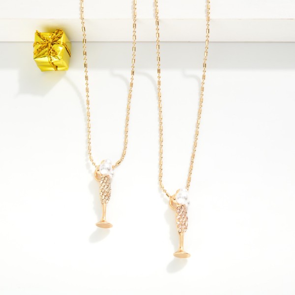 Ball & Chain Necklace Featuring Rhinestone & Pearl Champagne Glass Pendant 

- Approximately 16" L
- Extender 2" L