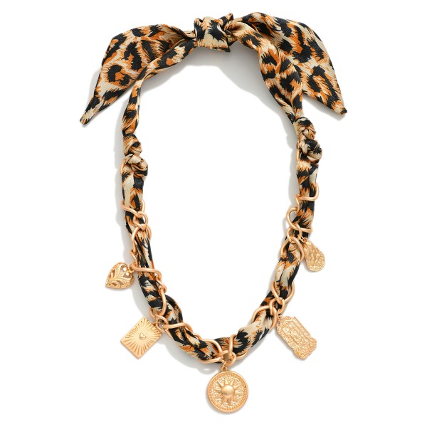Leopard Bandana Charm Necklace Featuring Gold Tone Charms 

- Approximately 18" L 