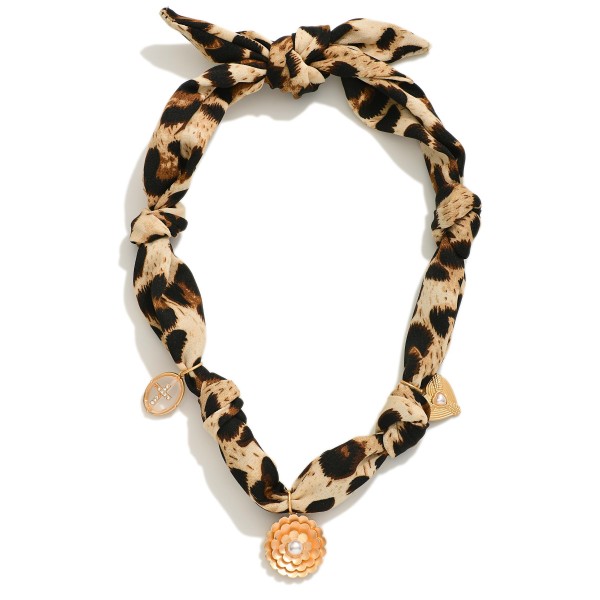 Leopard Bandana Charm Necklace Featuring Gold Tones, Rhinestones And Peals 

- Approximately 16" L 