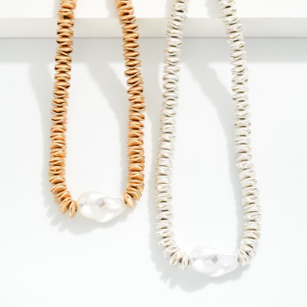 Metal Tone Beaded Necklace Featuring Disc Beads, Wavy Disc Beads & Baroque Pearl Pendent 

- Approximately 14" L 
