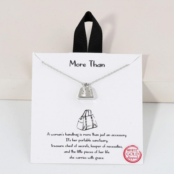 Dainty Chain Link Necklace Featuring Metal Tone Handbag Pendant 	
					
- Approximately 16" L					
- Extender 2" L					
- Hypoallergenic Brass Base					
- 18K Gold Dipped					
- Card: "A women's handbag is more than just an accessory. It's her portable sanctuary, treasure chest of secrets, keeper of necessities, and the little piece of her life she carries with grace."					