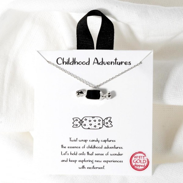 Dainty Chain Link Necklace Featuring Metal Tone Candy Pendant			
					
- Approximately 16" L					
- Extender 2" L					
- Hypoallergenic Brass Base					
- 18K Gold Dipped					
- Card: "Twist wrap candy captures the essence of childhood adventures. Let's hold onto the sense of wonder and keep exploring new experiences with excitement."					