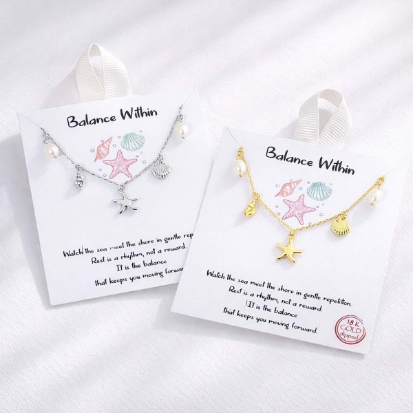 Dainty Chain Link Necklace Featuring Metal Tone Beach & Pearl Charms 			
					
- Approximately 16" L					
- Extender 2" L					
- Hypoallergenic Brass Base					
- 18K Gold Dipped					
- Card: "Watch the sea meet the shore in gentle repetition. Rest is a rhythm, not a reward. It is the balance that keeps you moving forward."					
					