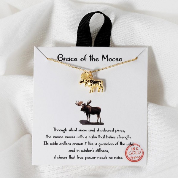 Dainty Chain Link Necklace Featuring Metal Tone Moose Pendant						
						
- Approximately 16" L						
- Extender 2" L						
- Hypoallergenic Brass Base						
- 18K Gold Dipped						
- Card: "Through silent snow and shadowed pines, the moose moves with a calm that belies strength. Its wide antlers crown it like a guardian of the wild, and in winter's stillness, it shows that true power needs no noise."						